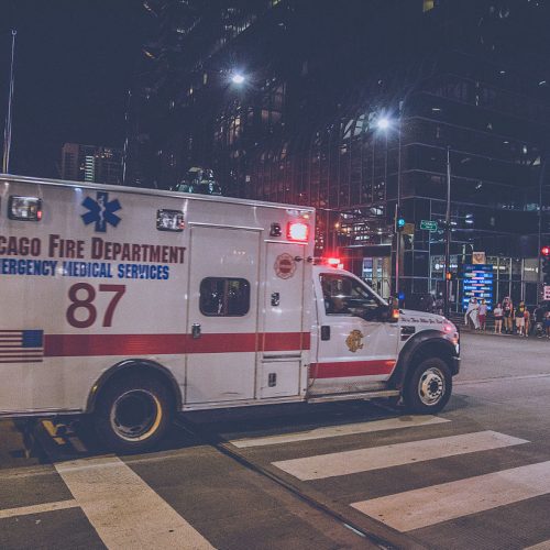 An ambulance drives down a street in Chicago.