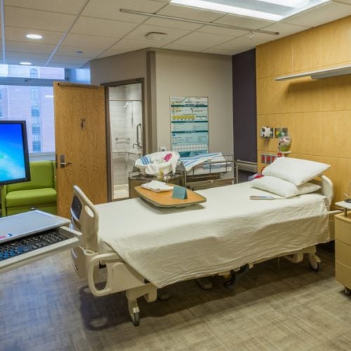 An empty hospital bed and room at the UI Health hospital.