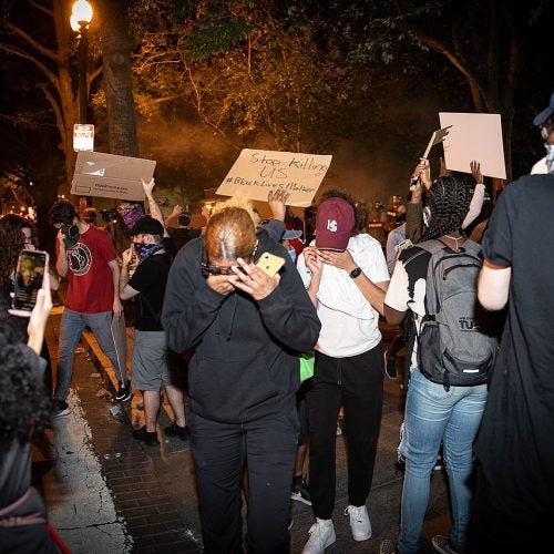 Protesters react to tear gas at George Floyd protests in Washington, D.C.